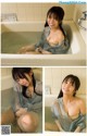 A woman in a bathtub with a blue shirt on.